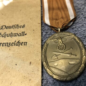 A German Westwall medal in packet of issue